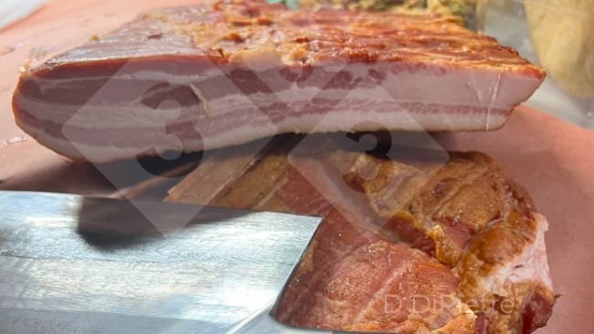 Figure 2. Author Dennis DiPietre makes his own bacon.